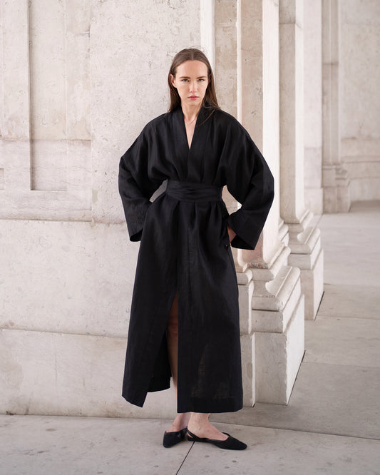 Woman wearing a long black robe 