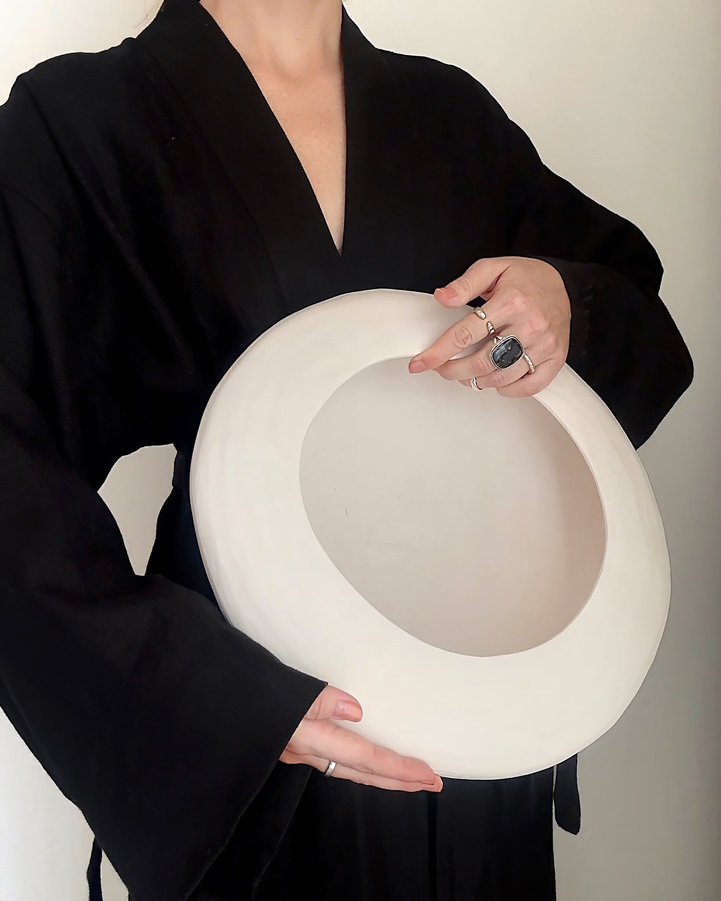 Decorative Dune Bowl by Original Design By KOTA, featuring a textured, earthy ceramic surface on a neutral background.